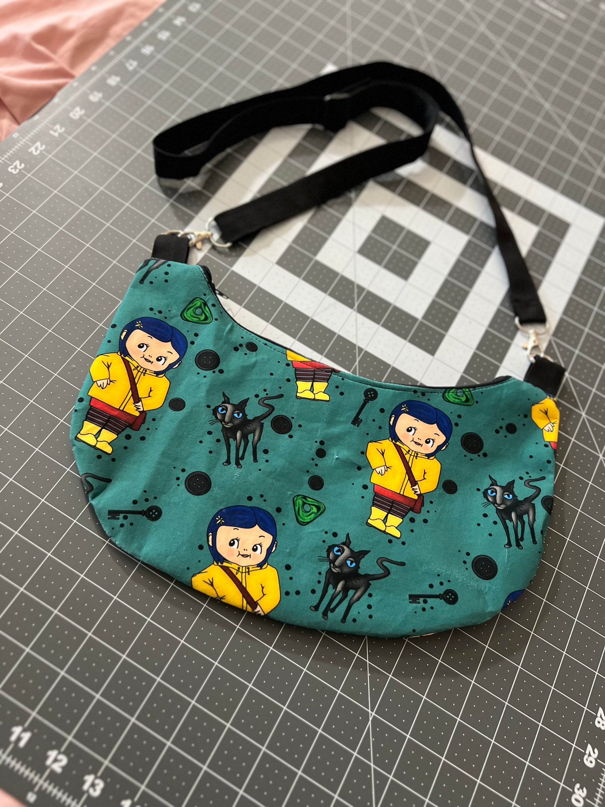 Cora Kewpie Crescent Crossbody Bag