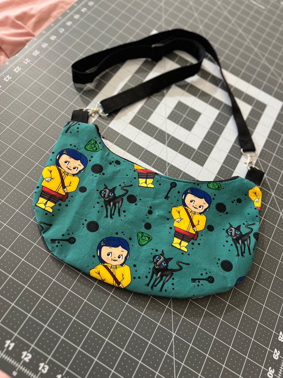 Cora Kewpie Crescent Crossbody Bag